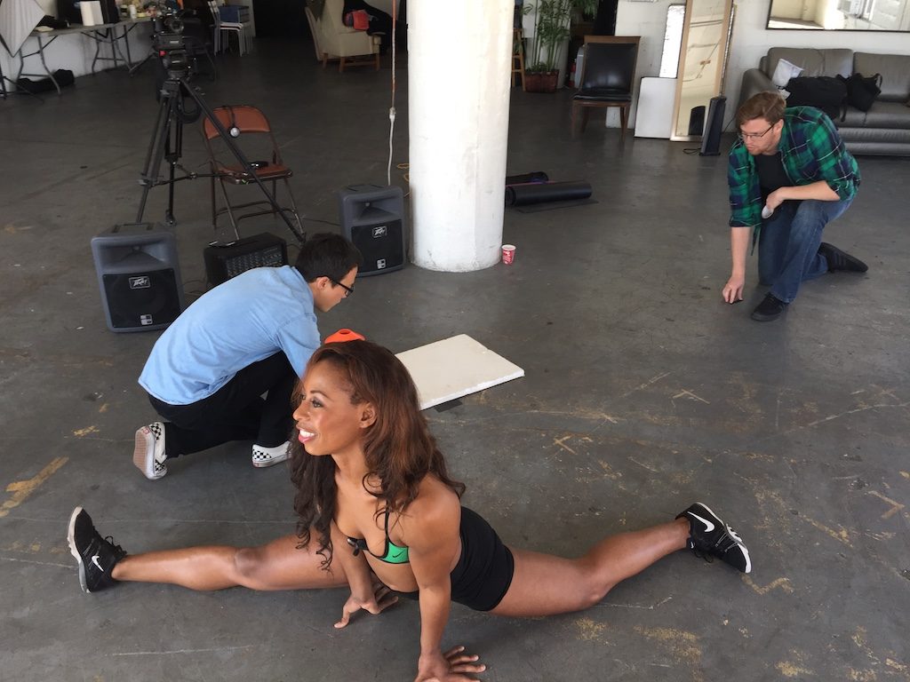 Nicole, casually sitting on set