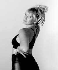 Black and white photo of Erica Hawkins, our burlesque dance instructor